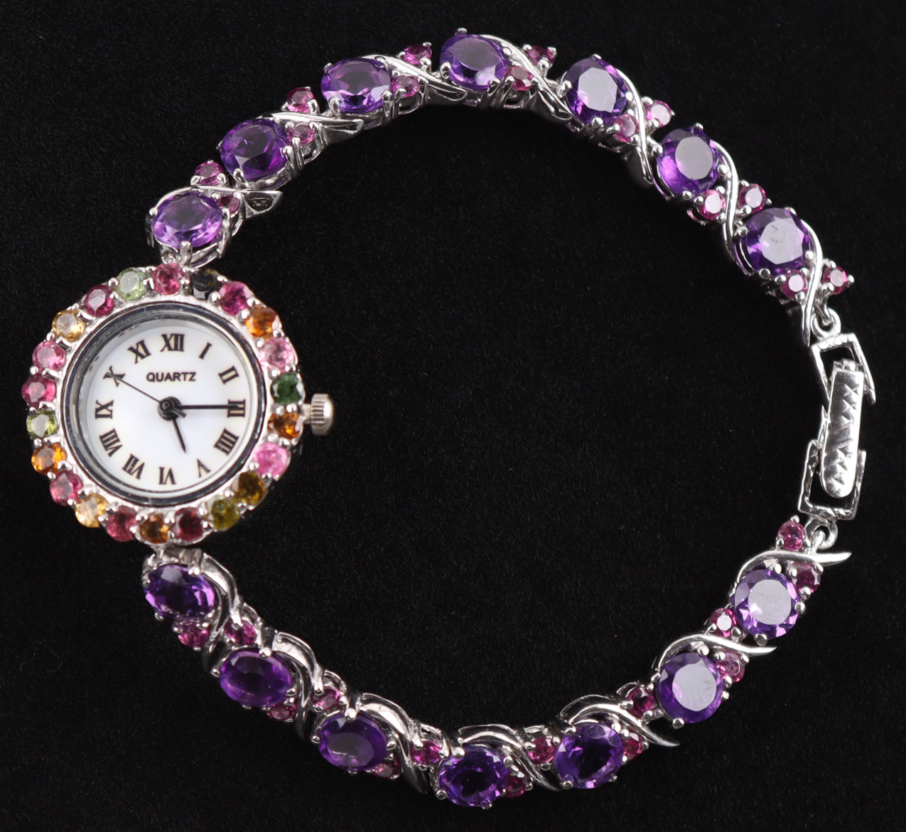 New 13.5 Carats Amethyst & Tourmaline Quartz Watch | Estimated Retail Value: $2,250 (UGL) at PristineAuction.com New 13.5 Carats Amethyst & Tourmaline Quartz Watch | Estimated Retail Value: $2,250 (UGL) at PristineAuction.com