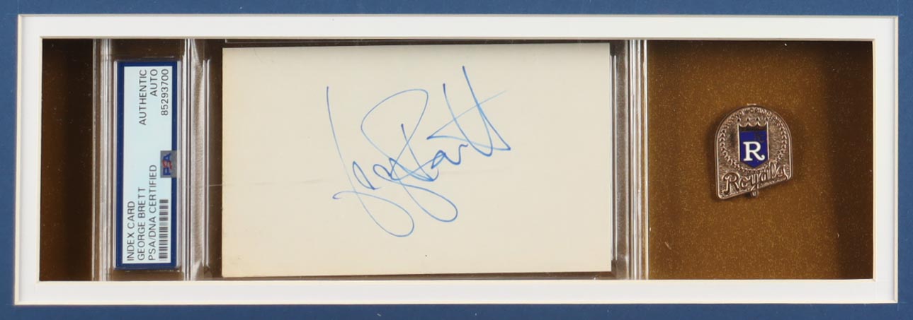 George Brett Signed Custom Framed Cut Display With Jersey, (2) Cloth team Logo Patches & World Series Gold Press Pin (PSA) at PristineAuction.com George Brett Signed Custom Framed Cut Display With Jersey, (2) Cloth team Logo Patches & World Series Gold Press Pin (PSA) at PristineAuction.com