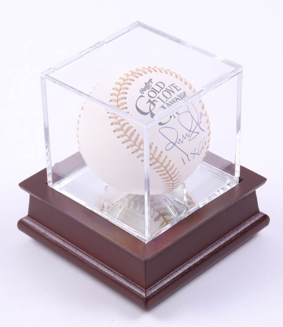 Omar Vizquel Signed Gold Glove Award Logo Baseball With Display Case Inscribed "11x GG" (Beckett) at PristineAuction.com Omar Vizquel Signed Gold Glove Award Logo Baseball With Display Case Inscribed "11x GG" (Beckett) at PristineAuction.com