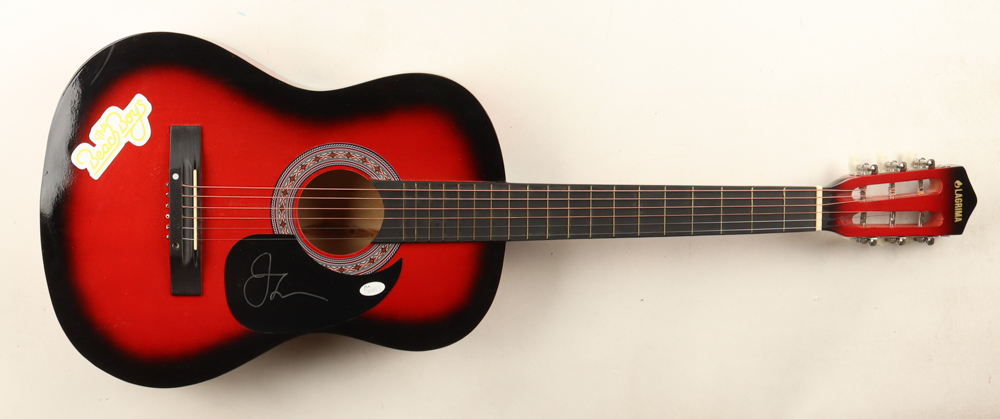 John Stamos Signed 38" Acoustic Guitar with Beach Boys Sticker & Display Stand (JSA) at PristineAuction.com John Stamos Signed 38" Acoustic Guitar with Beach Boys Sticker & Display Stand (JSA) at PristineAuction.com