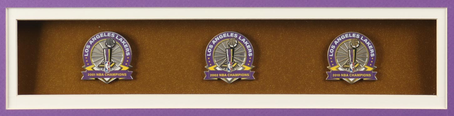 Kobe Bryant Lakers Custom Framed Jersey Display With LE 2000, 2002 & 2010 Championship Pins, (2) Cloth Team Logo Patches & (2) Photos at PristineAuction.com Kobe Bryant Lakers Custom Framed Jersey Display With LE 2000, 2002 & 2010 Championship Pins, (2) Cloth Team Logo Patches & (2) Photos at PristineAuction.com