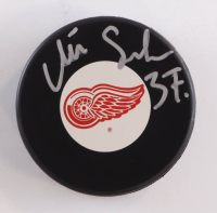 Mikael Samuelsson Signed Red Wings Logo Hockey Puck (Beckett) at PristineAuction.com