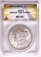 Mint Error 1886 Morgan Silver Dollar Struck Through Debris (ANACS MS62) at PristineAuction.com