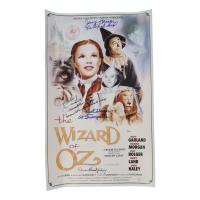 "The Wizard of Oz" 15x24 Movie Poster Photo Signed By (4) with Mickey Carroll, Jerry Maren, Karl Slover, Donna Stewart-Hardway With Character Inscriptions (JSA) at PristineAuction.com
