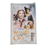 "The Wizard of Oz" 15x24 Movie Poster Photo Signed By (4) with Mickey Carroll, Jerry Maren, Karl Slover, Donna Stewart-Hardway With Character Inscriptions (JSA) at PristineAuction.com