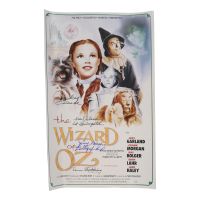 "The Wizard of Oz" 15x24 Movie Poster Photo Signed By (4) with Mickey Carroll, Jerry Maren, Karl Slover, Donna Stewart-Hardway With Character Inscriptions (JSA) at PristineAuction.com