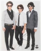 Nick Jonas, Joe Jonas & Kevin Jonas Signed 11x14 Photo (PSA & SportsMemorabilia) at PristineAuction.com