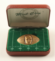 Brett Favre LE The Highland Mint Solid Bronze Commemorative Football Bullion Round at PristineAuction.com