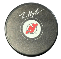 Luke Hughes Signed Devils Logo Puck (Fanatics) at PristineAuction.com