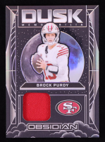 Brock Purdy 2024 Panini Obsidian Dusk Memorabilia #3 at PristineAuction.com