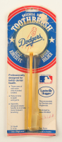 1986 Vintage MLB Licensed Dodgers Toothbrush with Dodgers Stand in Original Packaging at PristineAuction.com
