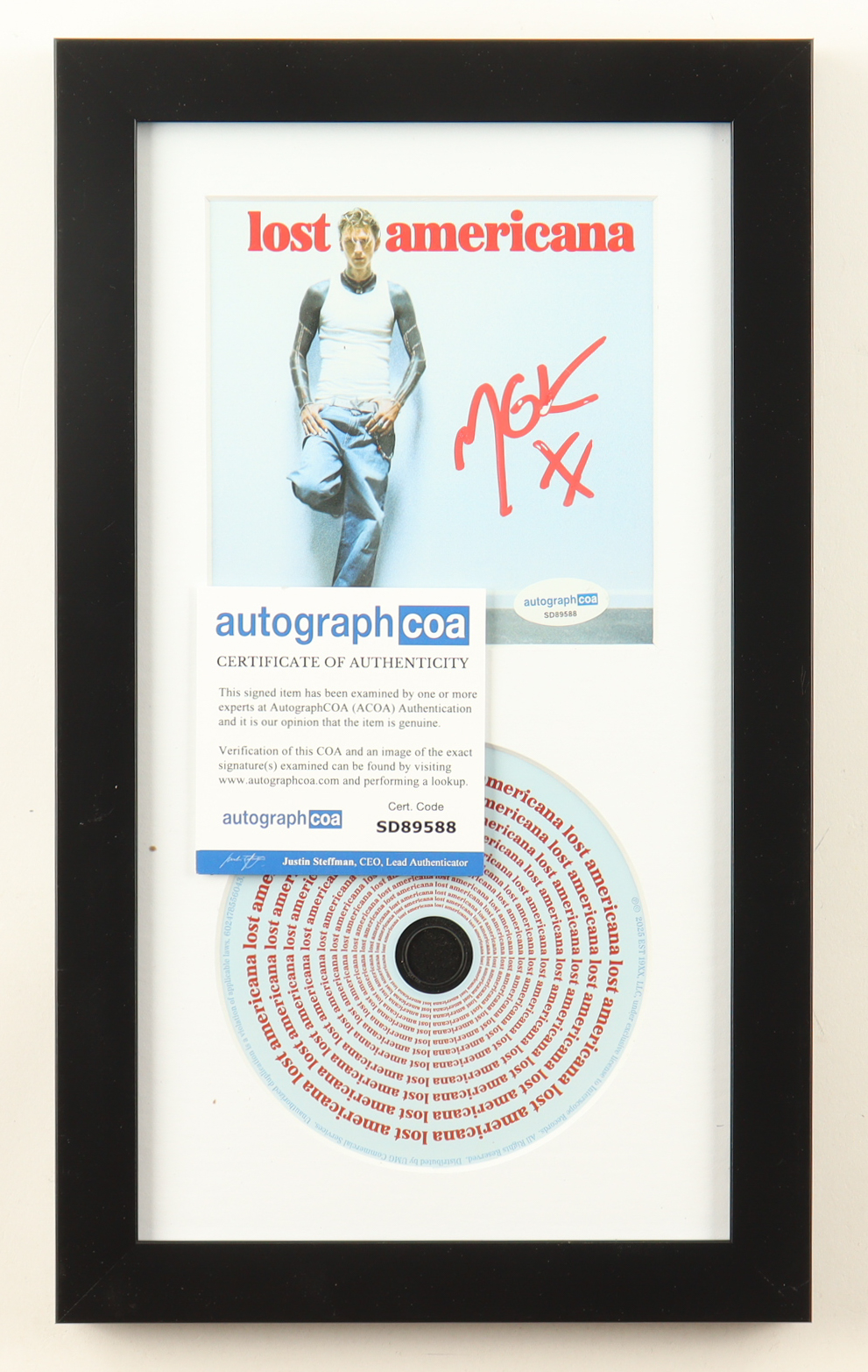 MGK Signed Custom Framed "Lost Americana" CD Album Insert Display With Disc (ACOA) at PristineAuction.com MGK Signed Custom Framed "Lost Americana" CD Album Insert Display With Disc (ACOA) at PristineAuction.com