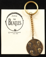 1964 Nems "The Beatles" Bronze Keychain on Original Selling Board at PristineAuction.com
