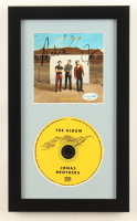 Joe Jonas, Kevin Jonas & Nick Jonas Signed "The Album" Custom Framed CD Insert Display (ACOA) at PristineAuction.com