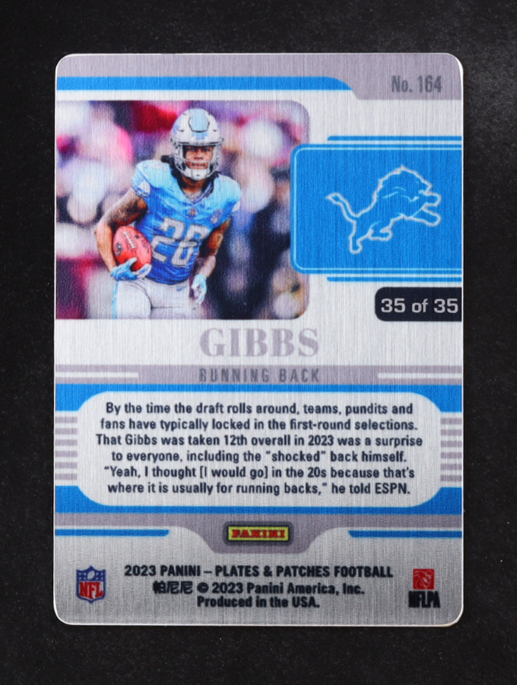 Jahmyr Gibbs 2023 Panini Plates and Patches Metal Vector #164 RC #35/35 at PristineAuction.com Jahmyr Gibbs 2023 Panini Plates and Patches Metal Vector #164 RC #35/35 at PristineAuction.com