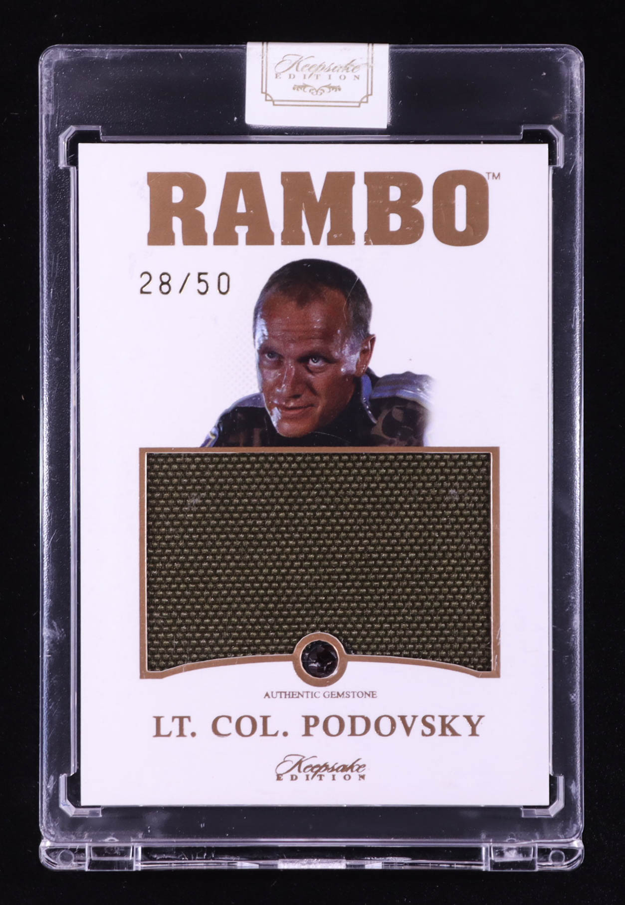 Lt. Col. Podovsky 2024 Keepsake Edition Gemstone Jumbo Relic Authentic Rambo II #216 #28/50 at PristineAuction.com Lt. Col. Podovsky 2024 Keepsake Edition Gemstone Jumbo Relic Authentic Rambo II #216 #28/50 at PristineAuction.com