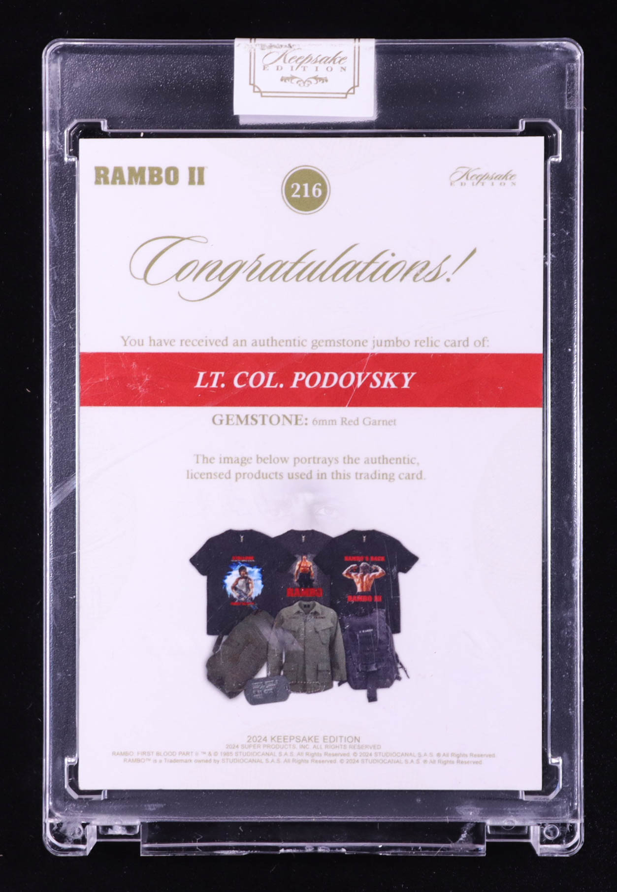 Lt. Col. Podovsky 2024 Keepsake Edition Gemstone Jumbo Relic Authentic Rambo II #216 #28/50 at PristineAuction.com Lt. Col. Podovsky 2024 Keepsake Edition Gemstone Jumbo Relic Authentic Rambo II #216 #28/50 at PristineAuction.com