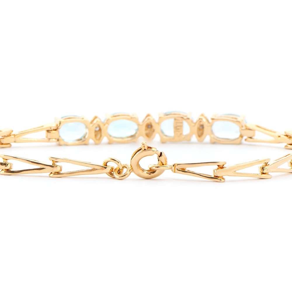 3.68 CTW Natural Blue Topaz & Diamonds 18K Gold Plated Designer Bracelet Size 7.6 Inches | Estimated Retail Value: $1,989 (AMG) at PristineAuction.com 3.68 CTW Natural Blue Topaz & Diamonds 18K Gold Plated Designer Bracelet Size 7.6 Inches | Estimated Retail Value: $1,989 (AMG) at PristineAuction.com