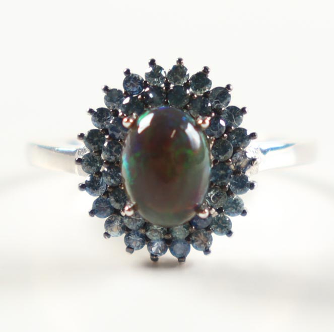 New 1.95 CTW Sapphire & Opal Ring | Estimated Retail Value: $1,575 (UGL) at PristineAuction.com New 1.95 CTW Sapphire & Opal Ring | Estimated Retail Value: $1,575 (UGL) at PristineAuction.com