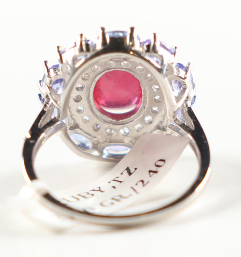 New 6.78 CTW Ruby & Tanzanite Ring | Estimated Retail Value: $2,100 (UGL) at PristineAuction.com New 6.78 CTW Ruby & Tanzanite Ring | Estimated Retail Value: $2,100 (UGL) at PristineAuction.com