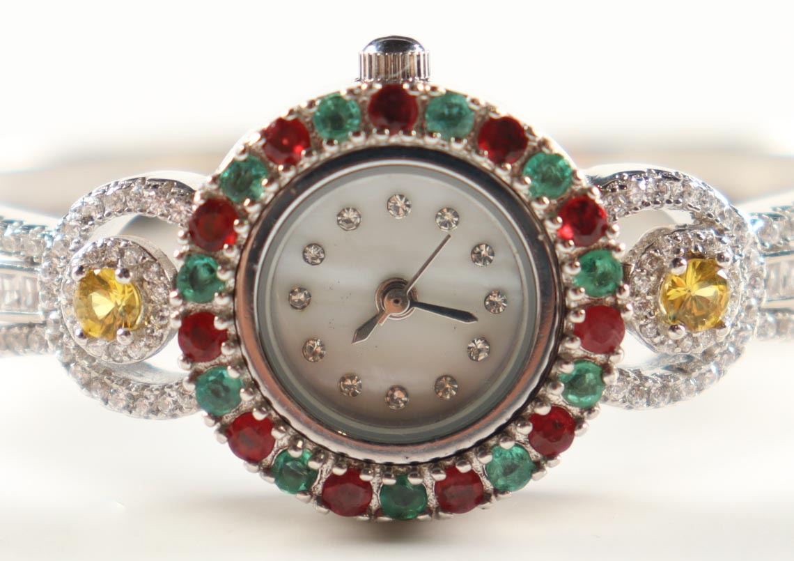 New 4.9 CTW Emerald, Ruby & Sapphire Bangle Watch | Estimated Retail Value: $1,800 (UGL) at PristineAuction.com New 4.9 CTW Emerald, Ruby & Sapphire Bangle Watch | Estimated Retail Value: $1,800 (UGL) at PristineAuction.com