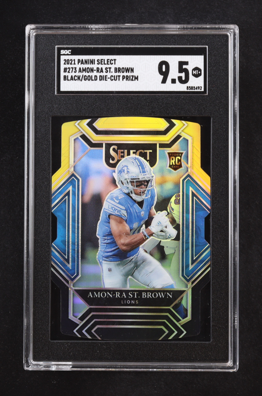 Amon-Ra St. Brown 2021 Select Prizm Black and Gold Die Cut #273 RC (SGC 9.5) at PristineAuction.com Amon-Ra St. Brown 2021 Select Prizm Black and Gold Die Cut #273 RC (SGC 9.5) at PristineAuction.com