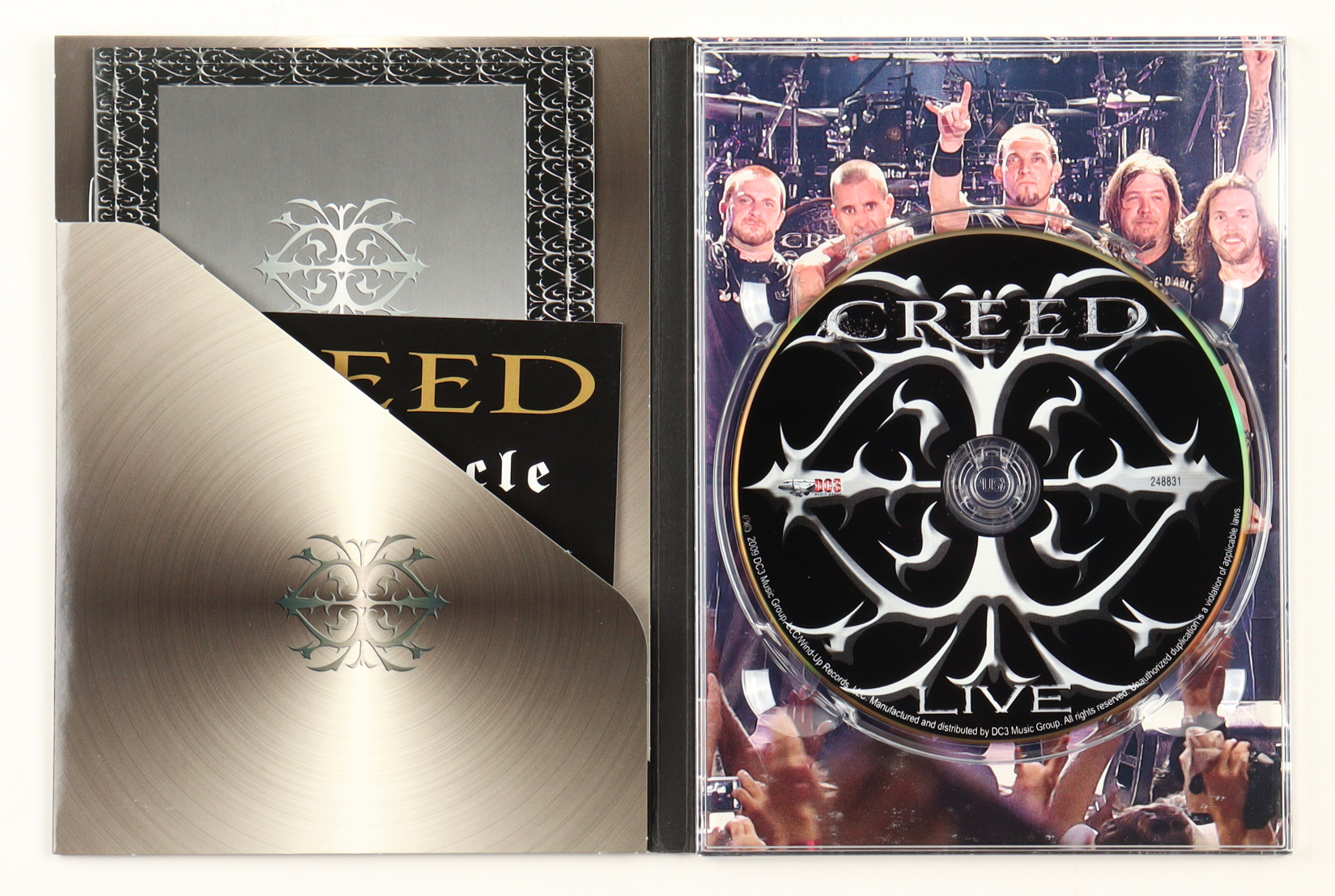 Creed "Creed Live" Concert DVD Signed by (4) with Brian Marshall, Scott Phillips (JSA) at PristineAuction.com Creed "Creed Live" Concert DVD Signed by (4) with Brian Marshall, Scott Phillips (JSA) at PristineAuction.com