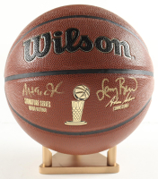 Larry Bird & Magic Johnson Signed NBA Basketball With Display Stand (PSA & Beckett) at PristineAuction.com
