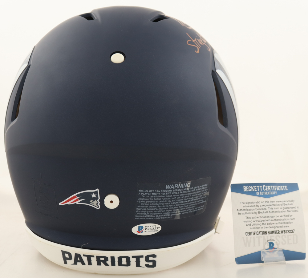 Randy Moss Signed Patriots Full-Size Authentic On-Field AMP Alternate Speed Helmet Inscribed "Straight Cash Homie" (Beckett) at PristineAuction.com Randy Moss Signed Patriots Full-Size Authentic On-Field AMP Alternate Speed Helmet Inscribed "Straight Cash Homie" (Beckett) at PristineAuction.com