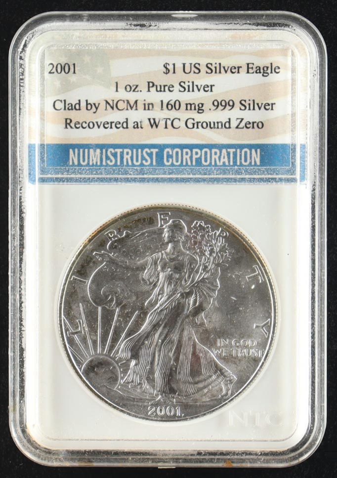 2001 Silver Eagle 1oz. Pure Silver $1 Dollar Coin / Recovered at WTC Ground Zero (NTC) at PristineAuction.com 2001 Silver Eagle 1oz. Pure Silver $1 Dollar Coin / Recovered at WTC Ground Zero (NTC) at PristineAuction.com