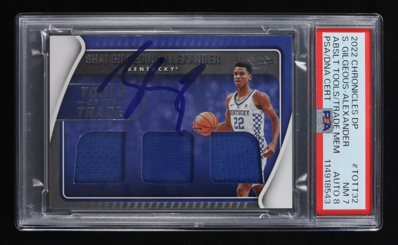 Shai Gilgeous-Alexander 2022-23 Panini Chronicles Draft Picks Absolute Tools of the Trade #32 (PSA 7 | Auto Grade 8) at PristineAuction.com Shai Gilgeous-Alexander 2022-23 Panini Chronicles Draft Picks Absolute Tools of the Trade #32 (PSA 7 | Auto Grade 8) at PristineAuction.com