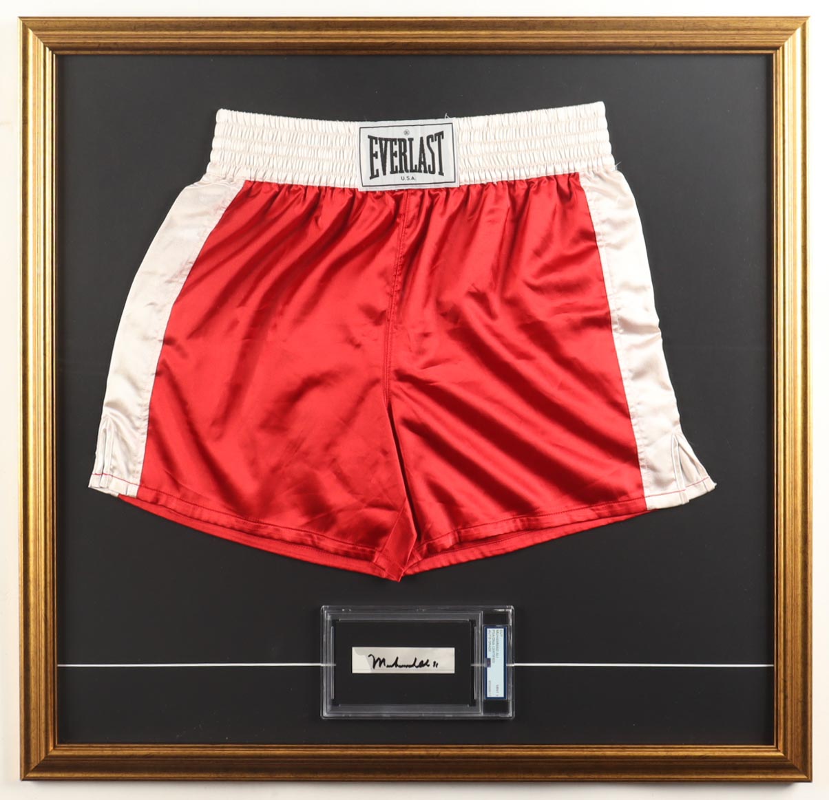 Muhammad Ali Signed Custom Framed Cut Display with Everlast Boxing Trunks (PSA | Mint 9) at PristineAuction.com Muhammad Ali Signed Custom Framed Cut Display with Everlast Boxing Trunks (PSA | Mint 9) at PristineAuction.com