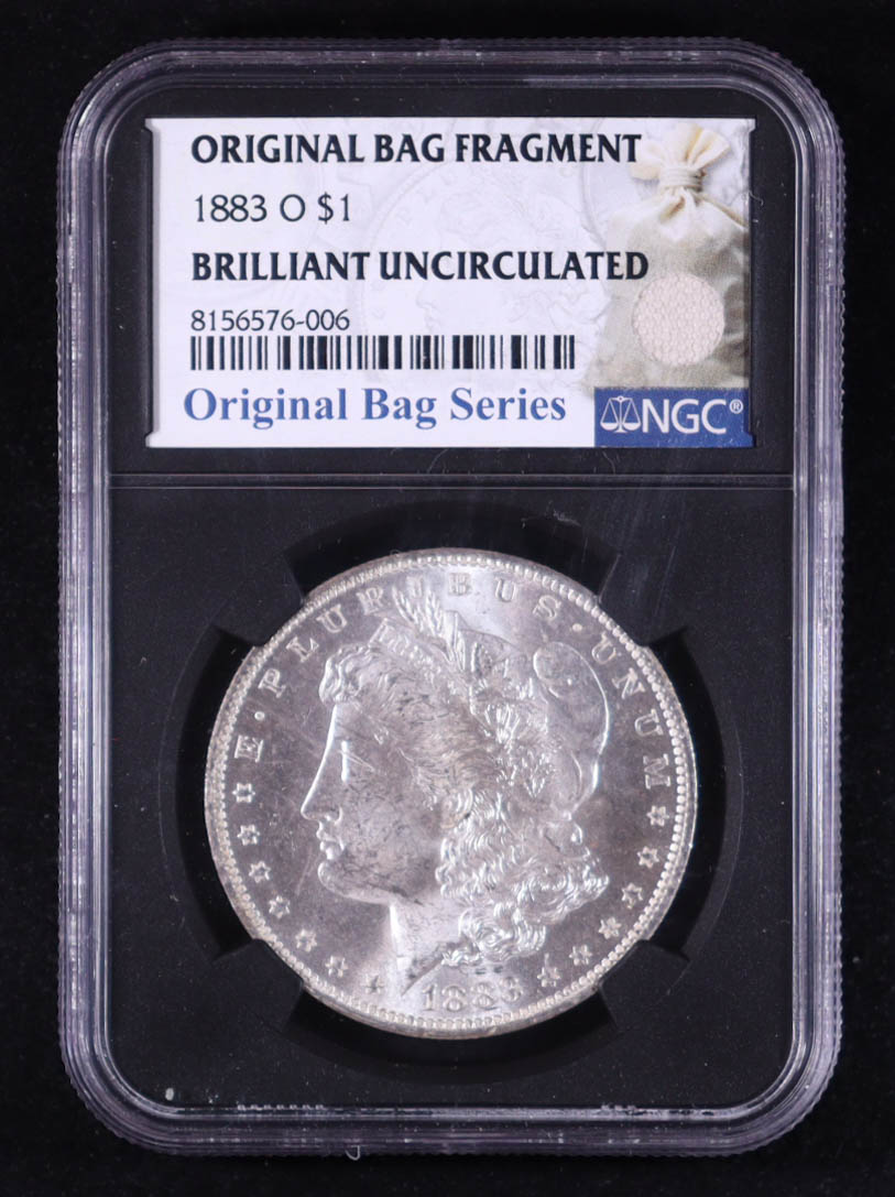 1883-O Morgan Silver Dollar - Original Bag Fragment Relic (NGC BRILLIANT UNCIRCULATED) at PristineAuction.com 1883-O Morgan Silver Dollar - Original Bag Fragment Relic (NGC BRILLIANT UNCIRCULATED) at PristineAuction.com