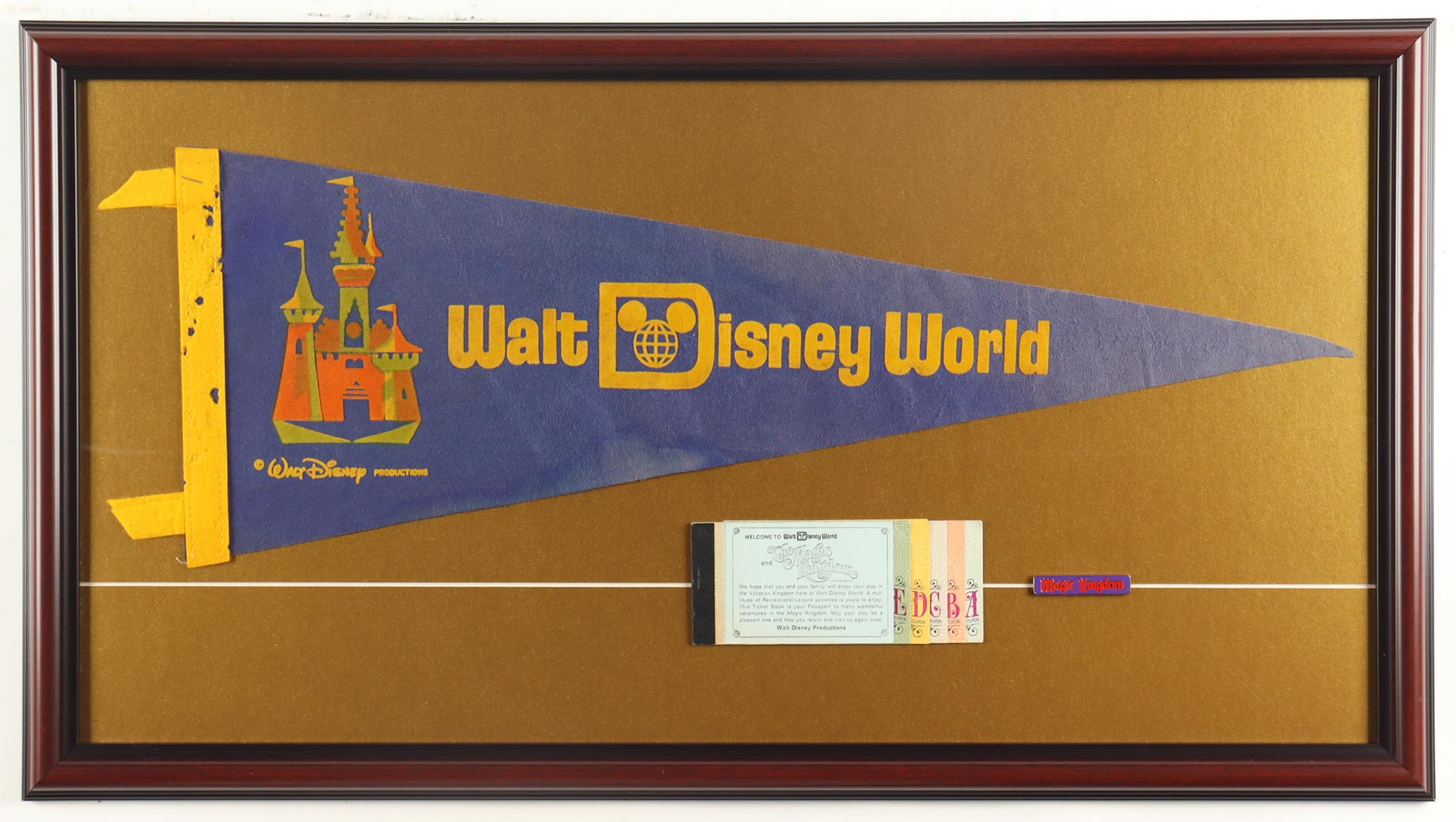 Custom Framed 1975 Walt Disney World Vintage Felt Pennant Flag & A-E Ticket Book at PristineAuction.com Custom Framed 1975 Walt Disney World Vintage Felt Pennant Flag & A-E Ticket Book at PristineAuction.com