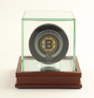 Official Game Issued Boston Bruins Logo Hockey Puck at PristineAuction.com