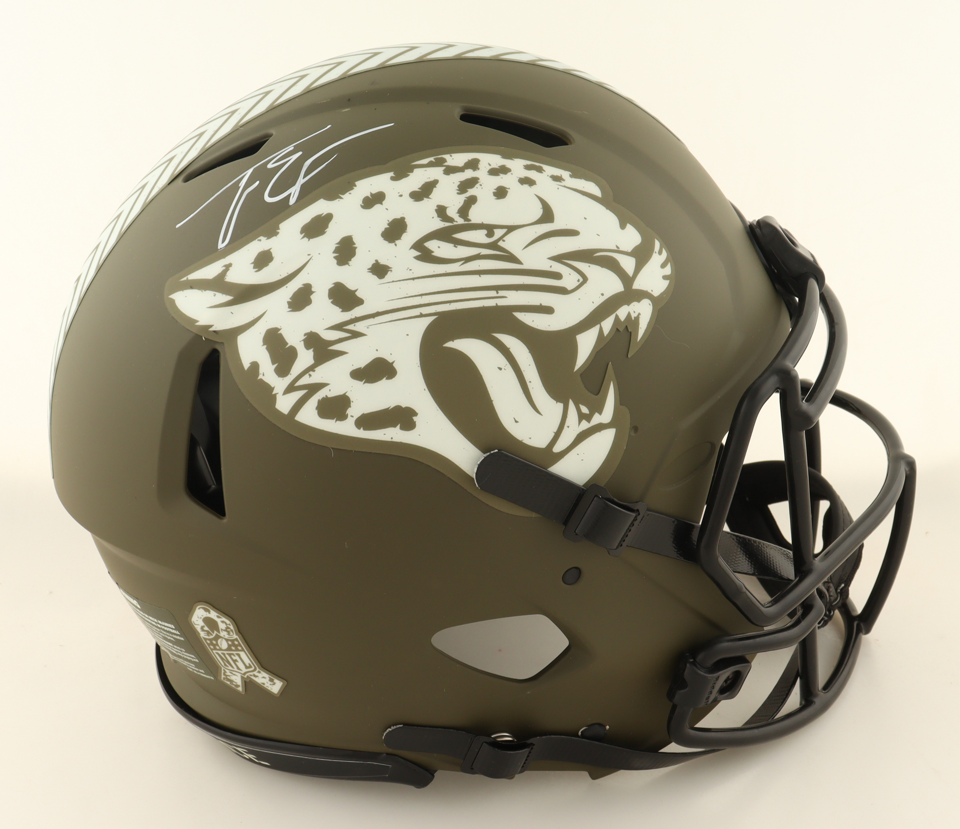 Travis Etienne Jr. Signed Jaguars Full-Size Authentic On-Field Salute To Service Alternate Speed Helmet (JSA) at PristineAuction.com Travis Etienne Jr. Signed Jaguars Full-Size Authentic On-Field Salute To Service Alternate Speed Helmet (JSA) at PristineAuction.com