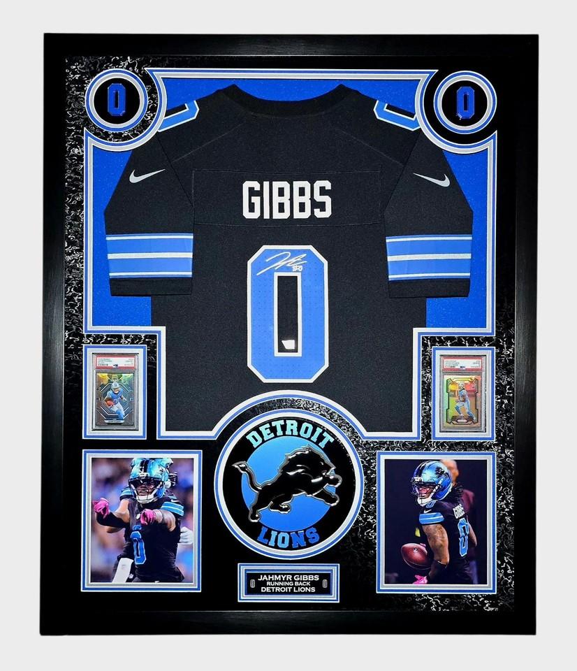 Jahmyr Gibbs Signed Lions Custom Framed LED Jersey Display with (2) PSA 10 Rookie Cards (Fanatics) at PristineAuction.com Jahmyr Gibbs Signed Lions Custom Framed LED Jersey Display with (2) PSA 10 Rookie Cards (Fanatics) at PristineAuction.com