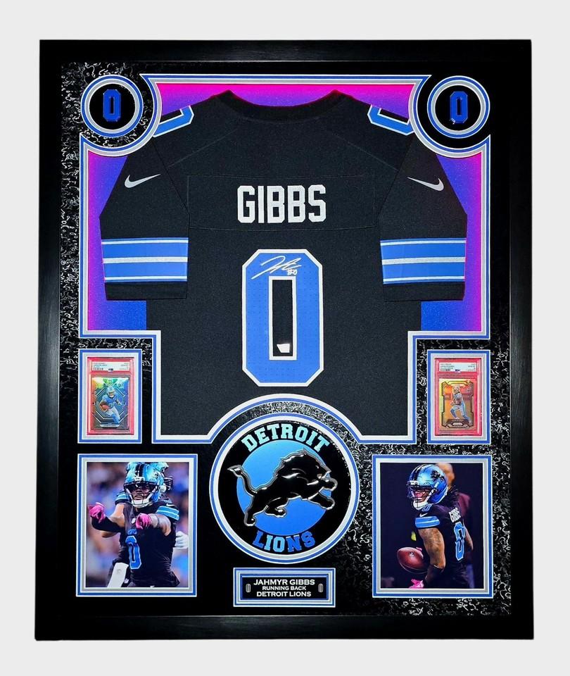 Jahmyr Gibbs Signed Lions Custom Framed LED Jersey Display with (2) PSA 10 Rookie Cards (Fanatics) at PristineAuction.com Jahmyr Gibbs Signed Lions Custom Framed LED Jersey Display with (2) PSA 10 Rookie Cards (Fanatics) at PristineAuction.com