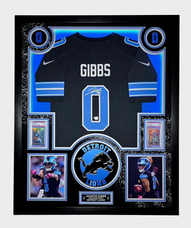 Jahmyr Gibbs Signed Lions Custom Framed LED Jersey Display with (2) PSA 10 Rookie Cards (Fanatics) at PristineAuction.com Jahmyr Gibbs Signed Lions Custom Framed LED Jersey Display with (2) PSA 10 Rookie Cards (Fanatics) at PristineAuction.com