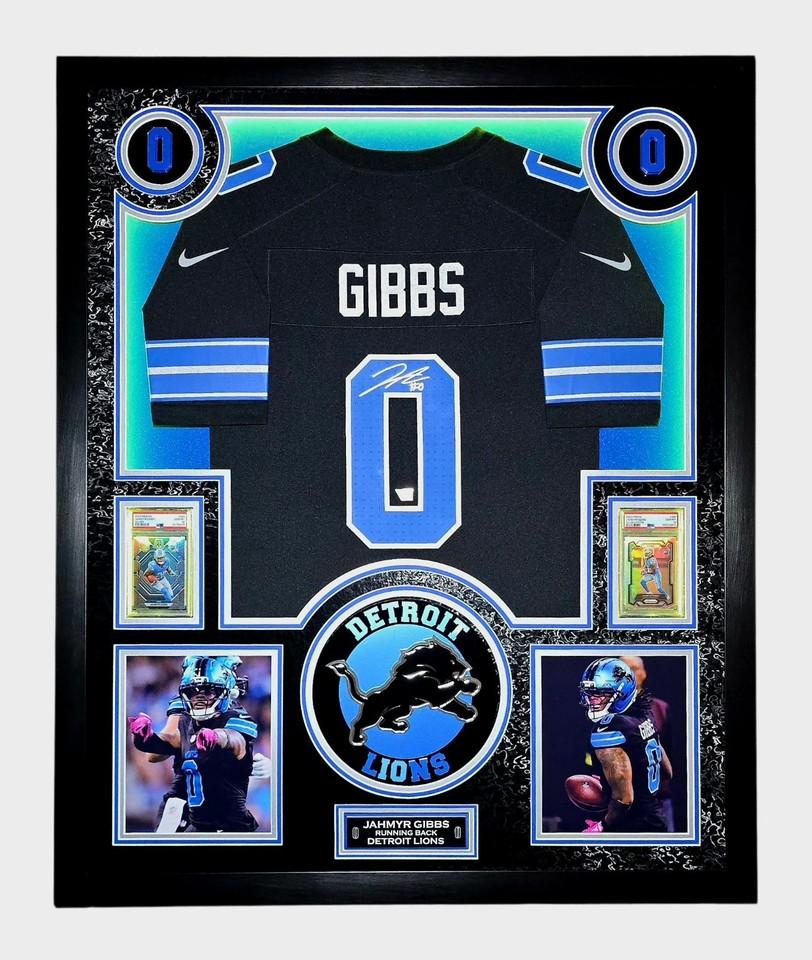 Jahmyr Gibbs Signed Lions Custom Framed LED Jersey Display with (2) PSA 10 Rookie Cards (Fanatics) at PristineAuction.com Jahmyr Gibbs Signed Lions Custom Framed LED Jersey Display with (2) PSA 10 Rookie Cards (Fanatics) at PristineAuction.com
