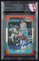 Reggie Theus Signed 1986-87 Fleer #108 With Game Used NBA Logo Patch (BGS | Auto Grade 10) at PristineAuction.com