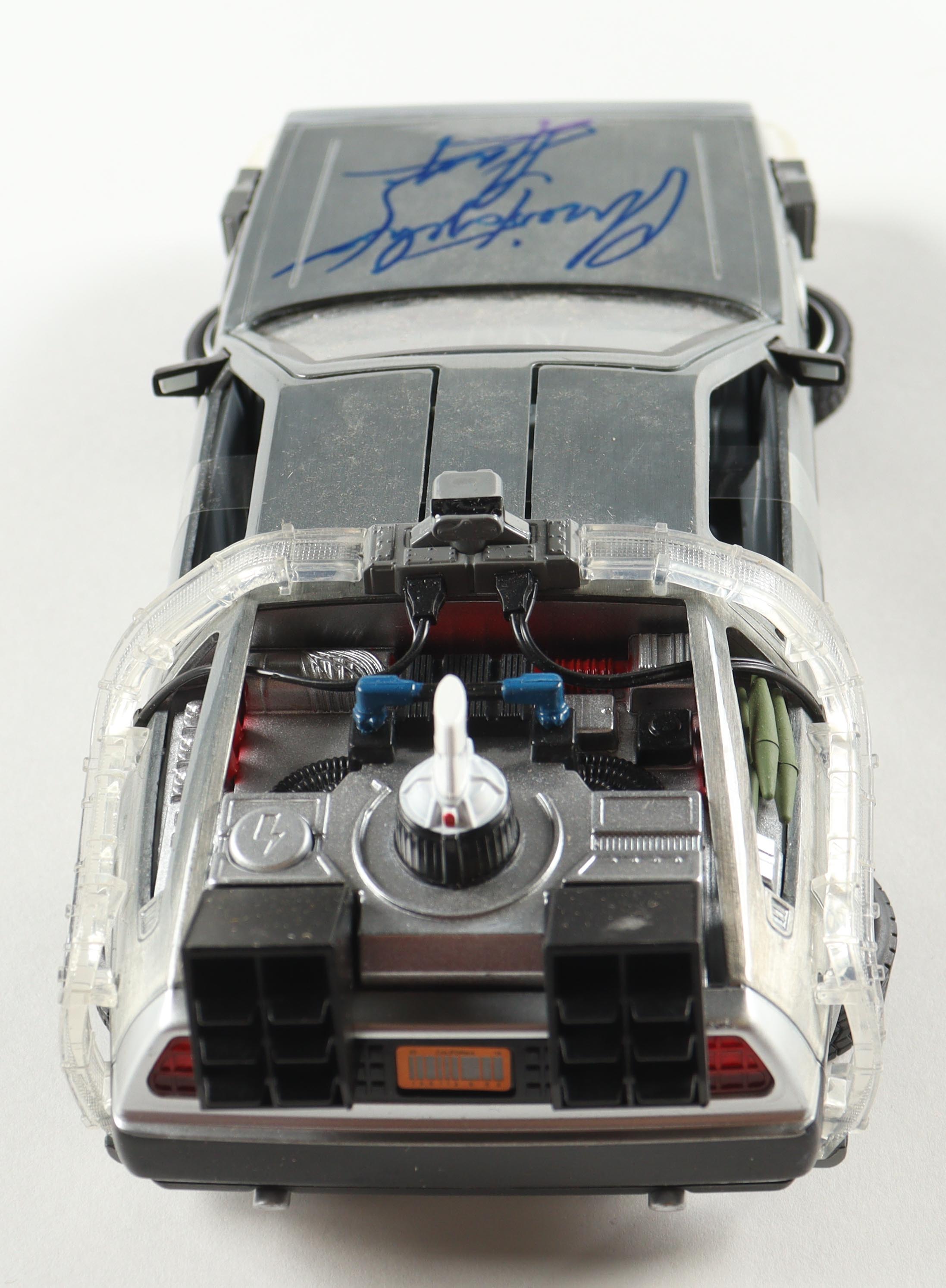Christopher Lloyd Signed "Back to the Future" DeLorean Time Machine 1:24 Scale Die-Cast Car (Beckett) at PristineAuction.com Christopher Lloyd Signed "Back to the Future" DeLorean Time Machine 1:24 Scale Die-Cast Car (Beckett) at PristineAuction.com