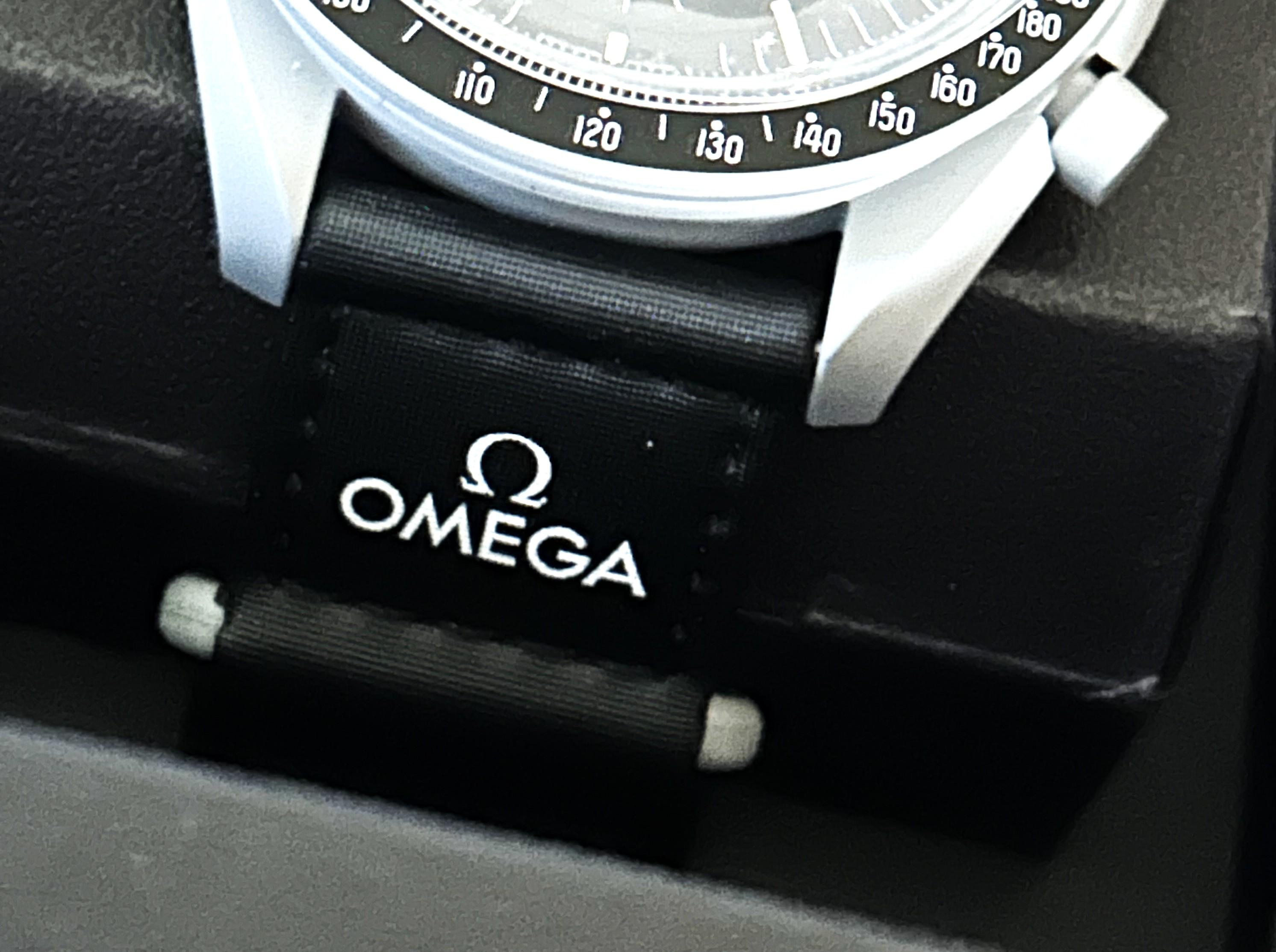 OMEGA x Swatch "Mission to the Moon" Men's 42mm Watch | Brand New with Box & Papers at PristineAuction.com OMEGA x Swatch "Mission to the Moon" Men's 42mm Watch | Brand New with Box & Papers at PristineAuction.com