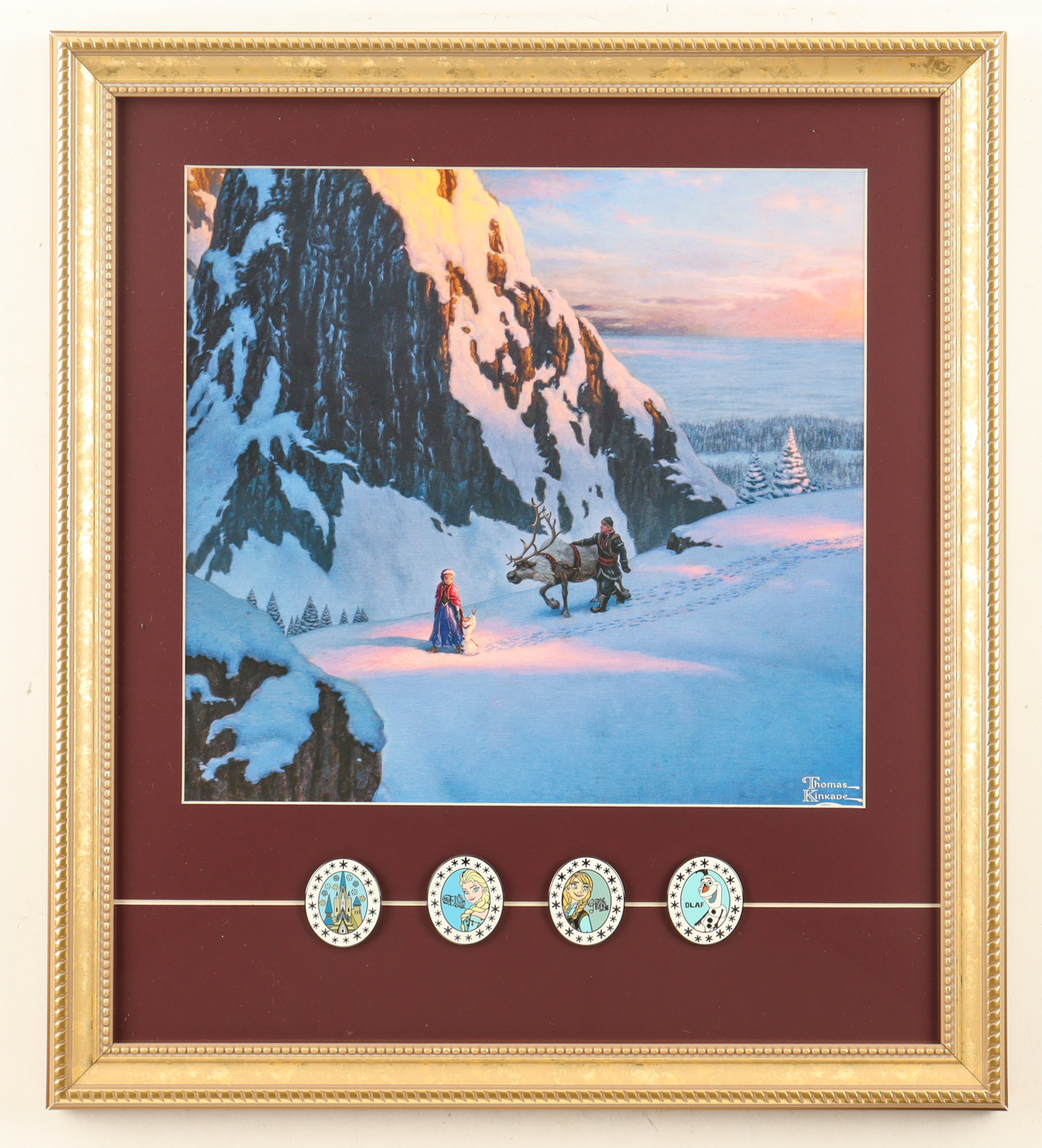 Thomas Kinkade "Frozen" Custom Framed Print Display with (4) Character Movie Pin Set at PristineAuction.com Thomas Kinkade "Frozen" Custom Framed Print Display with (4) Character Movie Pin Set at PristineAuction.com