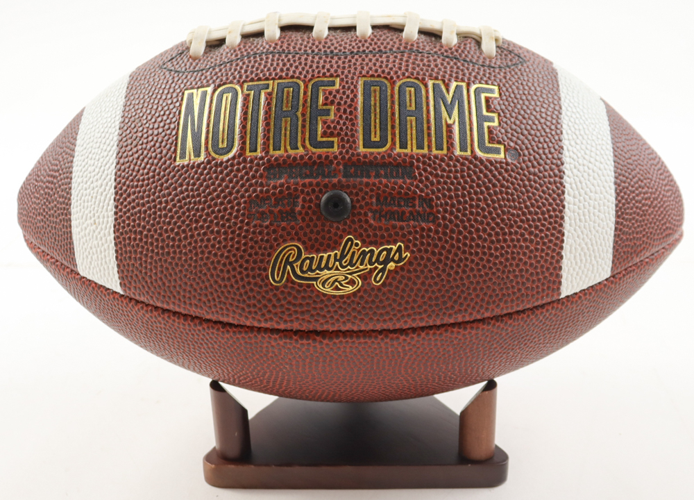 Notre Dame Logo Football with Display Stand at PristineAuction.com Notre Dame Logo Football with Display Stand at PristineAuction.com