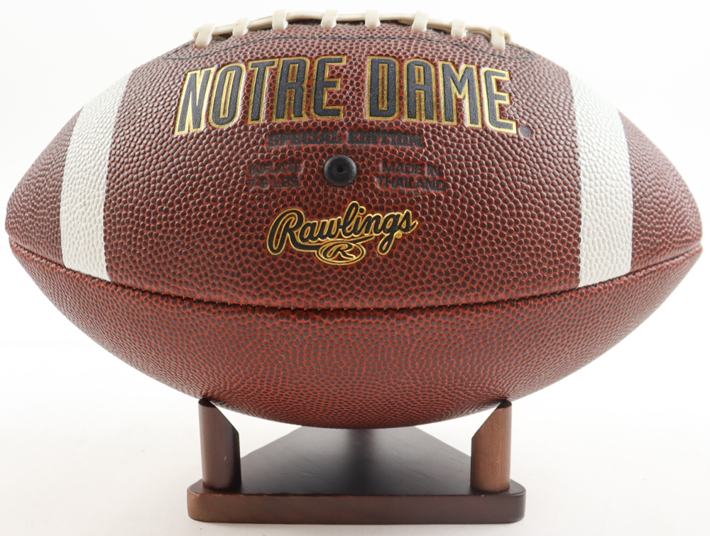Notre Dame Logo Football with Display Stand at PristineAuction.com Notre Dame Logo Football with Display Stand at PristineAuction.com