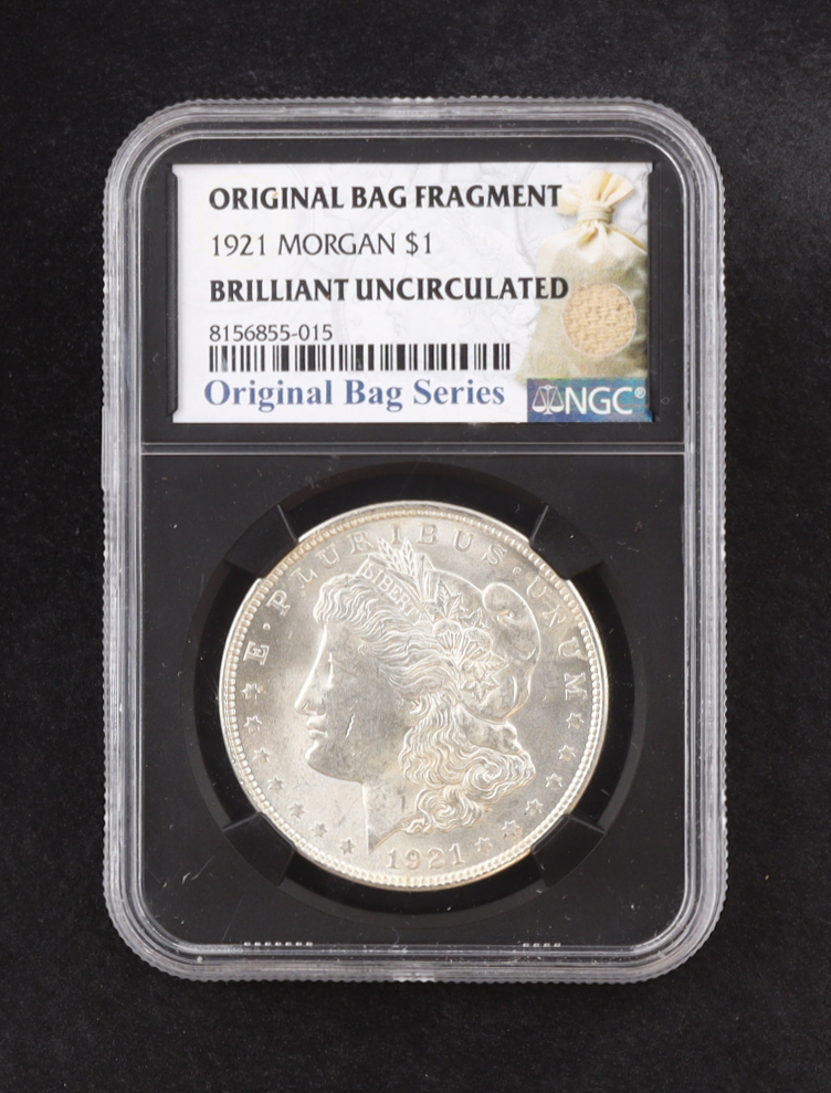 1921 Morgan Silver $1 Dollar - Original Bag Fragment Relic (NGC BRILLIANT UNCIRCULATED) at PristineAuction.com 1921 Morgan Silver $1 Dollar - Original Bag Fragment Relic (NGC BRILLIANT UNCIRCULATED) at PristineAuction.com
