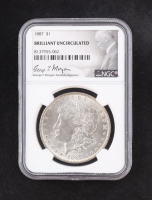 1887 Morgan Silver $1 Dollar - George T. Morgan Signature Label (NGC BRILLIANT UNCIRCULATED) at PristineAuction.com
