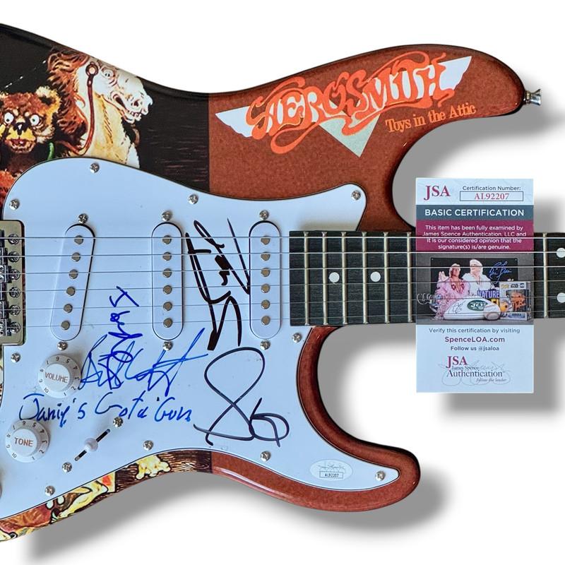 Aerosmith Custom Stratocaster Guitar Band-Signed By (5) with Steven Tyler, Joe Perry, Brad Whitford, Tom Hamilton & Joey Kramer (JSA) at PristineAuction.com Aerosmith Custom Stratocaster Guitar Band-Signed By (5) with Steven Tyler, Joe Perry, Brad Whitford, Tom Hamilton & Joey Kramer (JSA) at PristineAuction.com