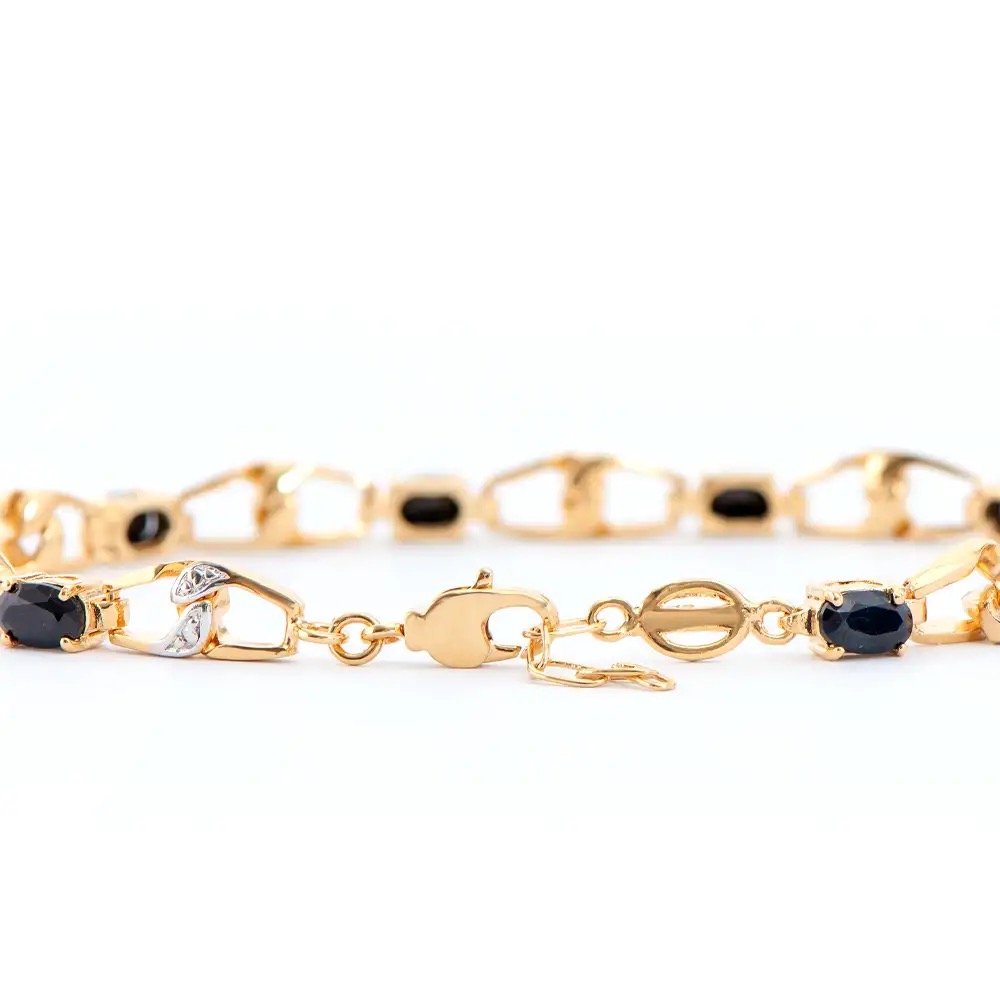6.59 CTW Black Sapphire & Diamonds 18K Gold Plated Designer Bracelet Size 8.5"| Estimated Retail Value: $1,899 (AMG) at PristineAuction.com 6.59 CTW Black Sapphire & Diamonds 18K Gold Plated Designer Bracelet Size 8.5"| Estimated Retail Value: $1,899 (AMG) at PristineAuction.com